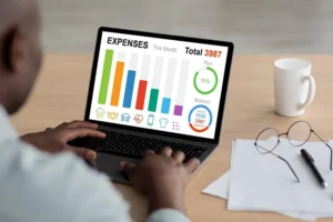 man-tracking-expenses-on-laptop