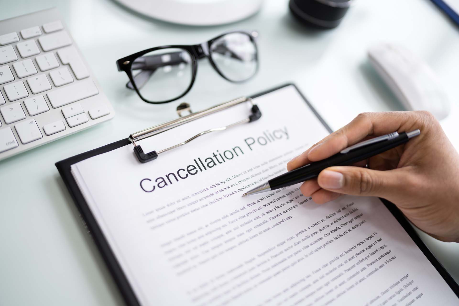 man-reviewing-document-cancellation-policy.jpg
