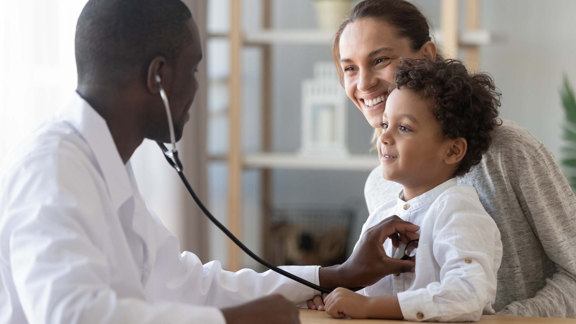 african-male-pediatrician-hold-stethoscope-exam-child.jpg