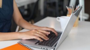 female-typing-on-laptop-computer-while-working.jpg