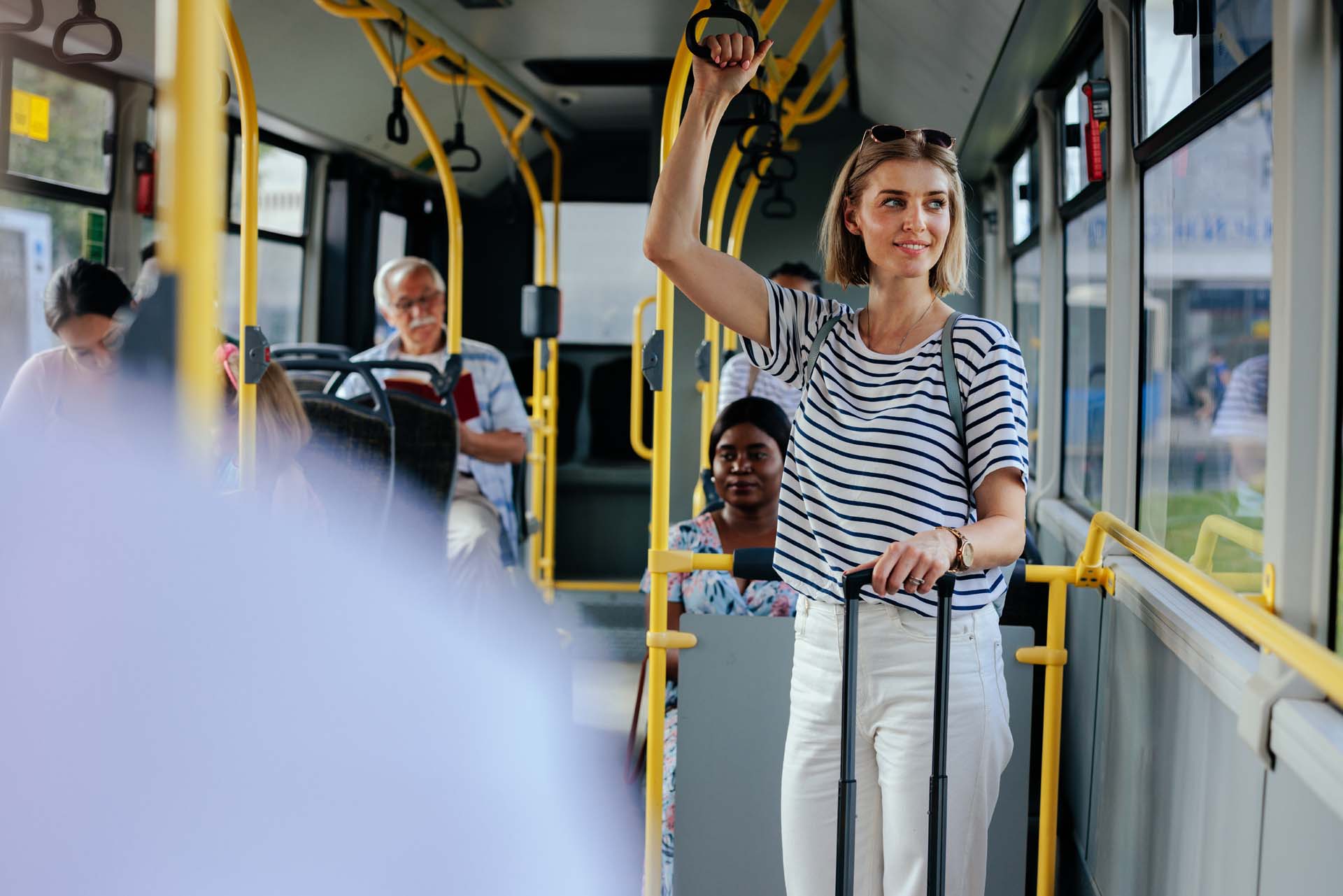 woman-in-shuttle-bus-looking-through-window.jpg